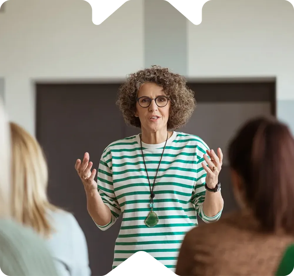 A woman presenting to an audience
